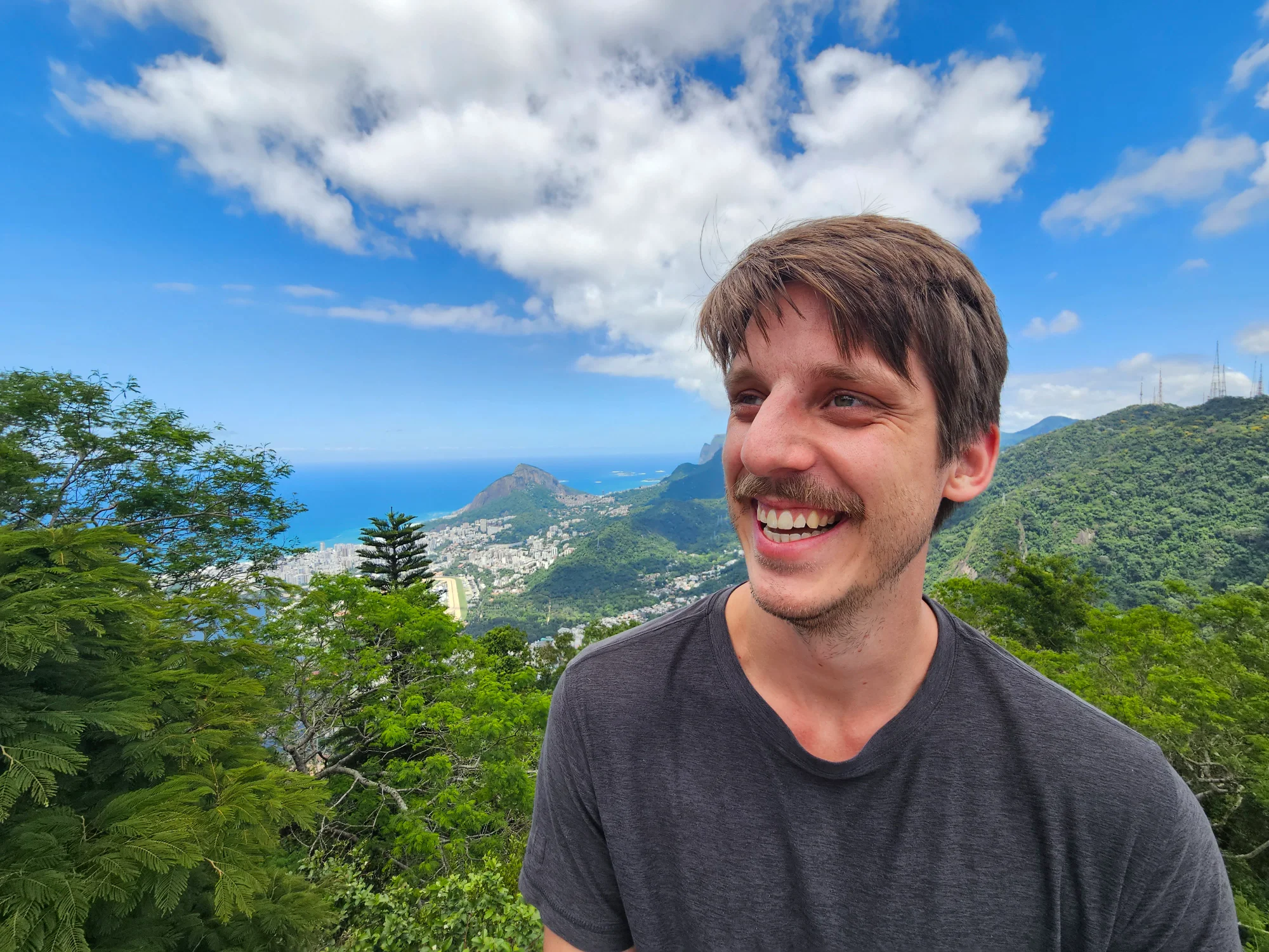 Mitch smiling with mountains in the background
